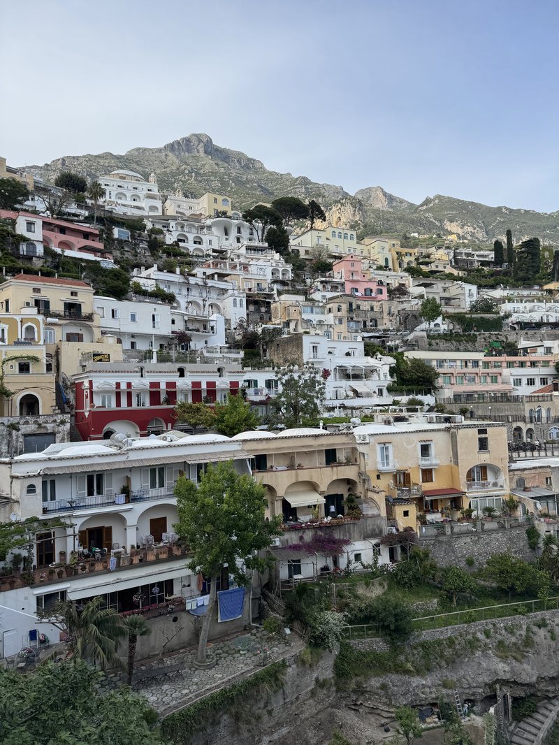 Pastel houses stacked above the Amalfi Coast